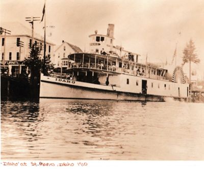 The Idaho

This Photo States: "The Idaho"
St. Maries, Idaho, 1910.
This is the Idaho at St. Maries in 1910. From Steamboats in the Timber (pp. 184-185) :

"Fire, too, claimed the big side-wheeler Idaho. This boat had been retired from active use and taken to Blackrock, a bay on the lake where a big apple orchard was located. The hull was used as a sorting and storage shed during apple harvest. In 1915, with a cargo of apples aboard, it burned to the water line and sank in the bay"

Photo Won in Auction thru Goodwill
