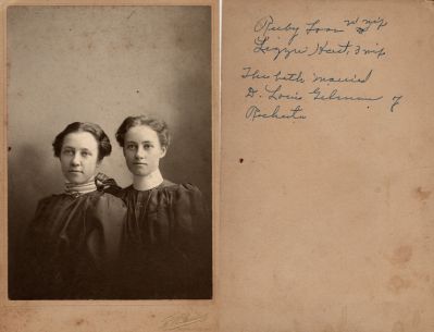 Ruby M. Foss Gilman & Elizabeth E. Hart Gilman

This Cabinet Card Photo States: "Ruby Foss, wife. Lizzie Hart, wife. They both married Dr. Louis Gilman of Rochester"

The Photographers name is "Bailey" Rochester, New York.
