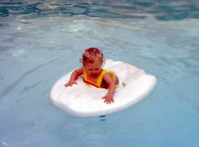 Kim

THIS HAS BEEN RETURNED TO FAMILY

This 35MM Slide States: "Kim in pool, June 1979."
